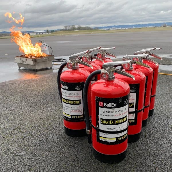BullEx fire extinguishers and fire extinguisher training system on airport tarmac