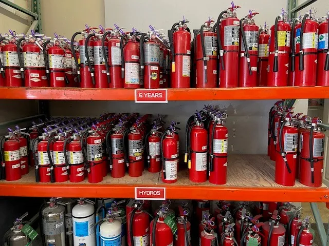 Shelf of fire extinguishers