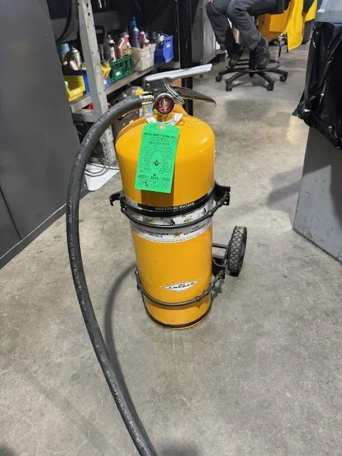 Yellow wheeled unit fire extinguisher