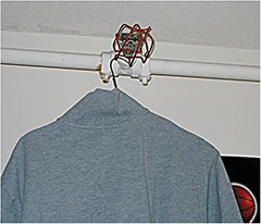 Shirt hanging on sprinkler head