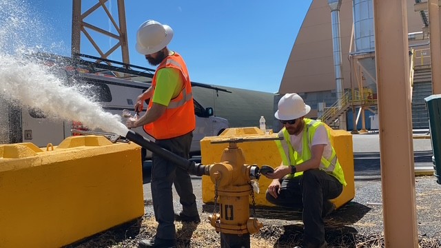 Fire hydrant with technicians